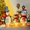 Lighted penguin family Christmas decoration with 160 LED lights, showcasing a dad in a top hat and mom in a Christmas.