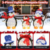 Lighted 3-piece penguin family Christmas decoration with 160 LED lights, featuring festive hats and red scarves for.