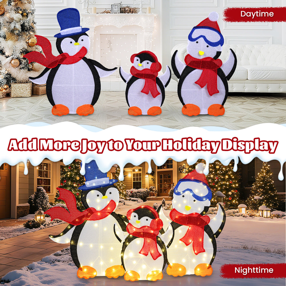Lighted 2D penguin family decoration with 160 LED lights, featuring a dad and mom in hats and red scarves for festive.
