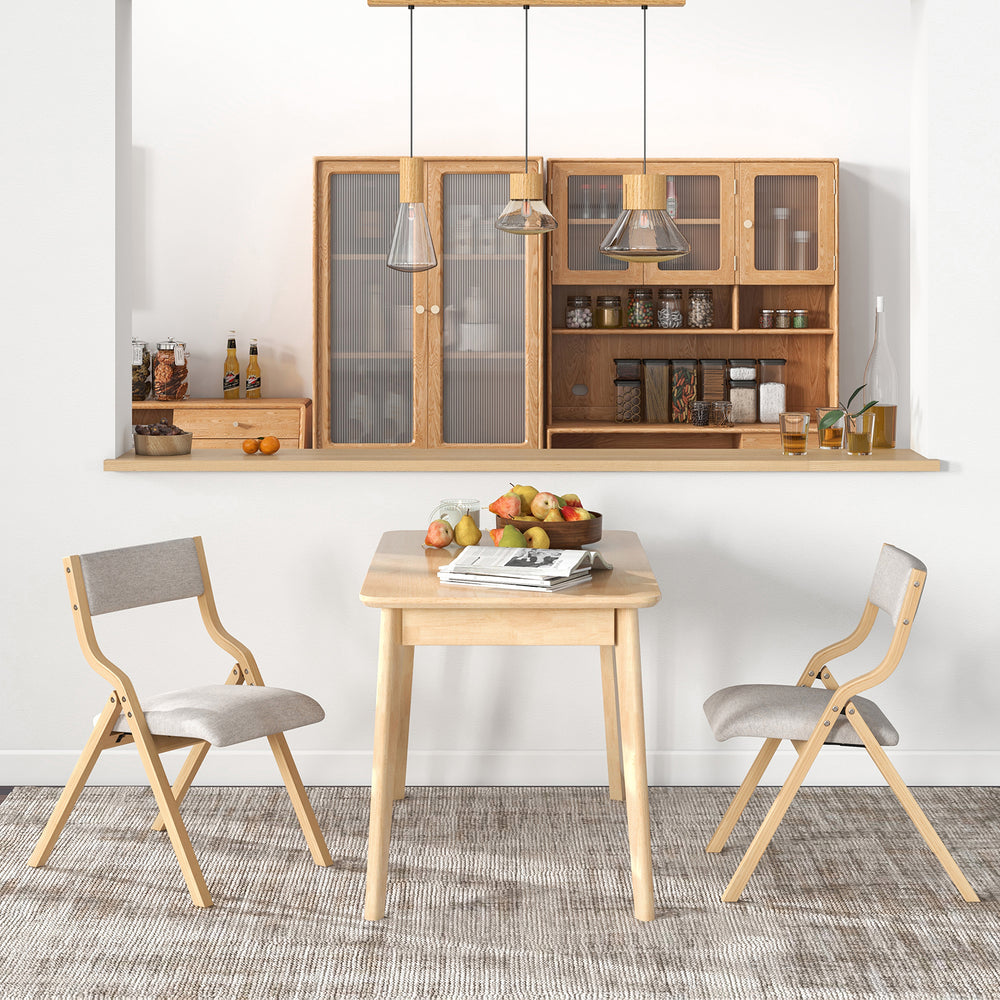 Folding dining chair set of 4 with solid wood frame and upholstered cushions, ideal for compact spaces and cozy seating.