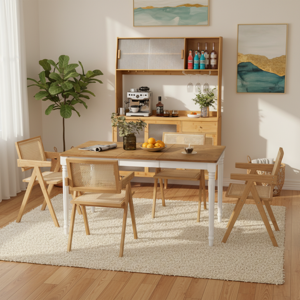 Extendable dining table with rattan accent chairs and kitchen cabinet, perfect for dining room or coffee bar area.