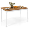 Extendable dining table with oak veneer top, paired with rattan accent chairs, perfect for kitchen or dining room use.