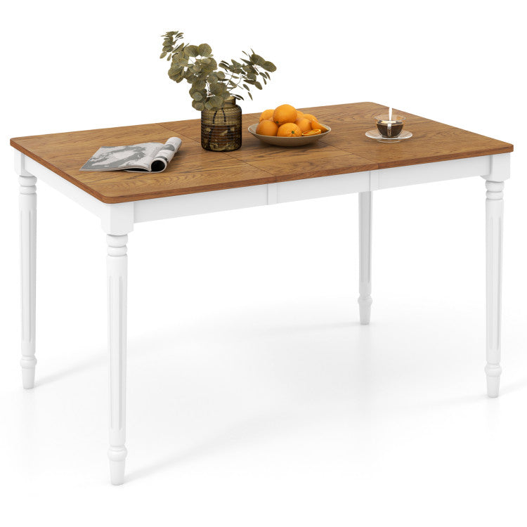 Extendable dining table with oak veneer top, paired with rattan accent chairs, perfect for kitchen or dining room use.