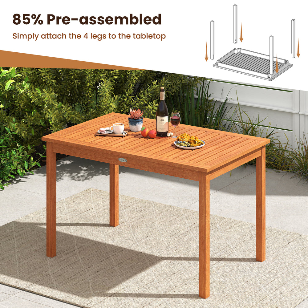 Outdoor rectangular dining table from a 5-piece patio wood set, featuring a slatted surface and solid wood construction.