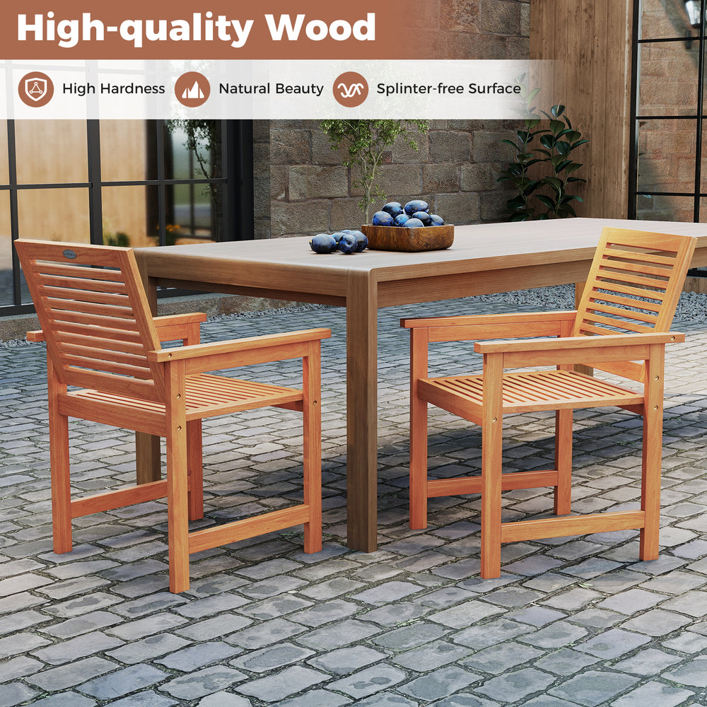 Two ergonomic wooden dining chairs with slatted surfaces beside a rectangular table, ideal for outdoor patio use.