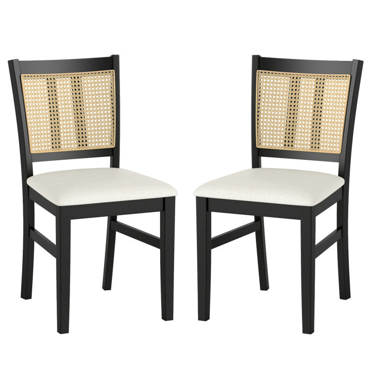 Two farmhouse rattan dining chairs with upholstered seats and solid rubber wood frames, ideal for modern dining spaces.