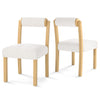 Two modern dining chairs with rubber wood frames and soft faux sherpa fabric, perfect for stylish dining rooms.
