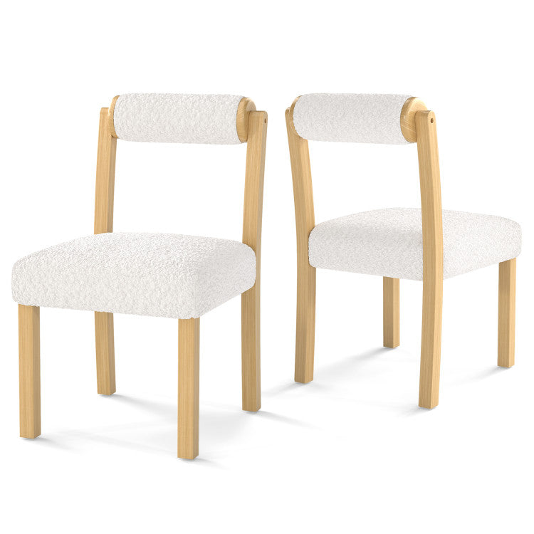Two modern dining chairs with rubber wood frames and soft faux sherpa fabric, perfect for stylish dining rooms.