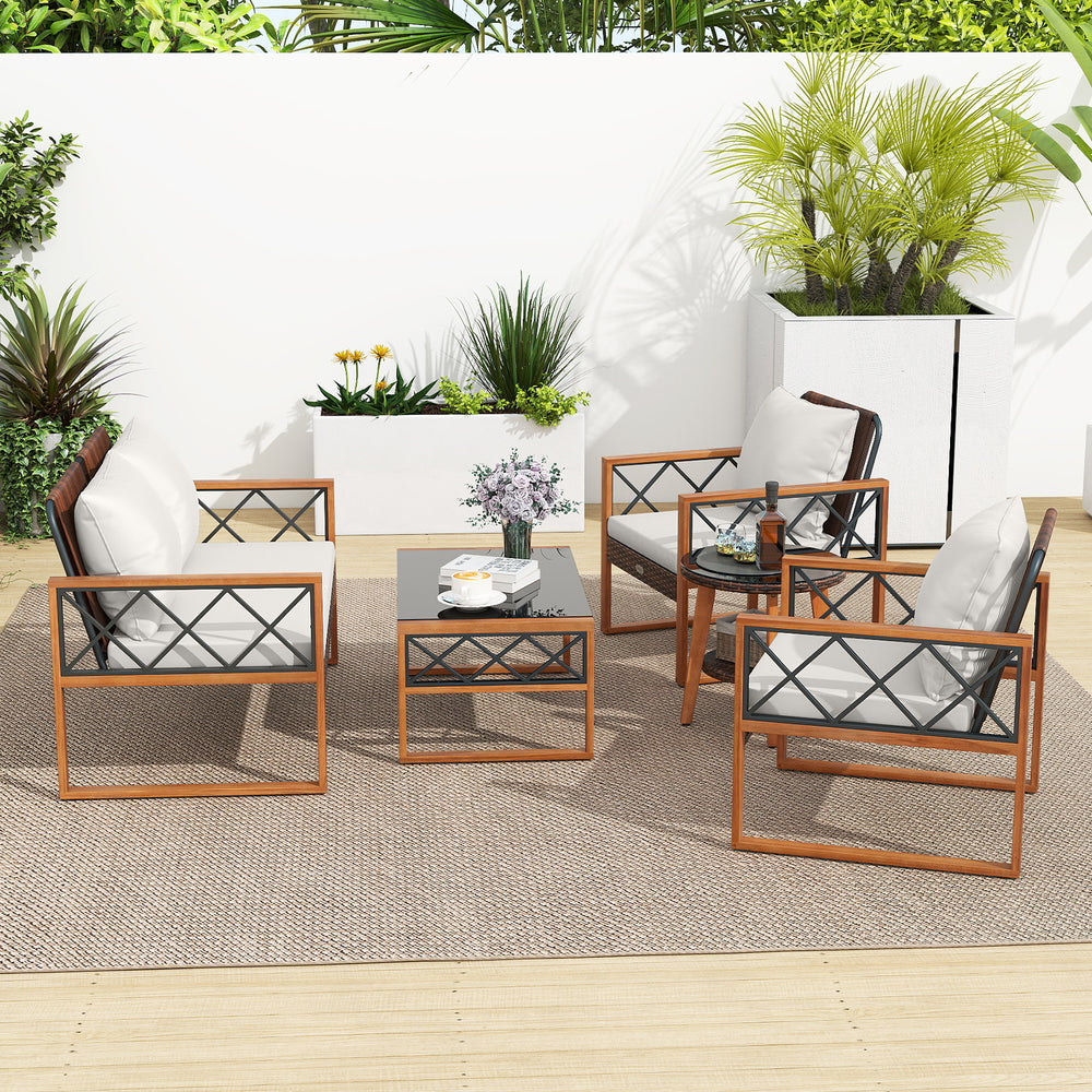 5-piece PE wicker patio furniture set with acacia wood frame, featuring cushioned chairs and tempered glass tables for.