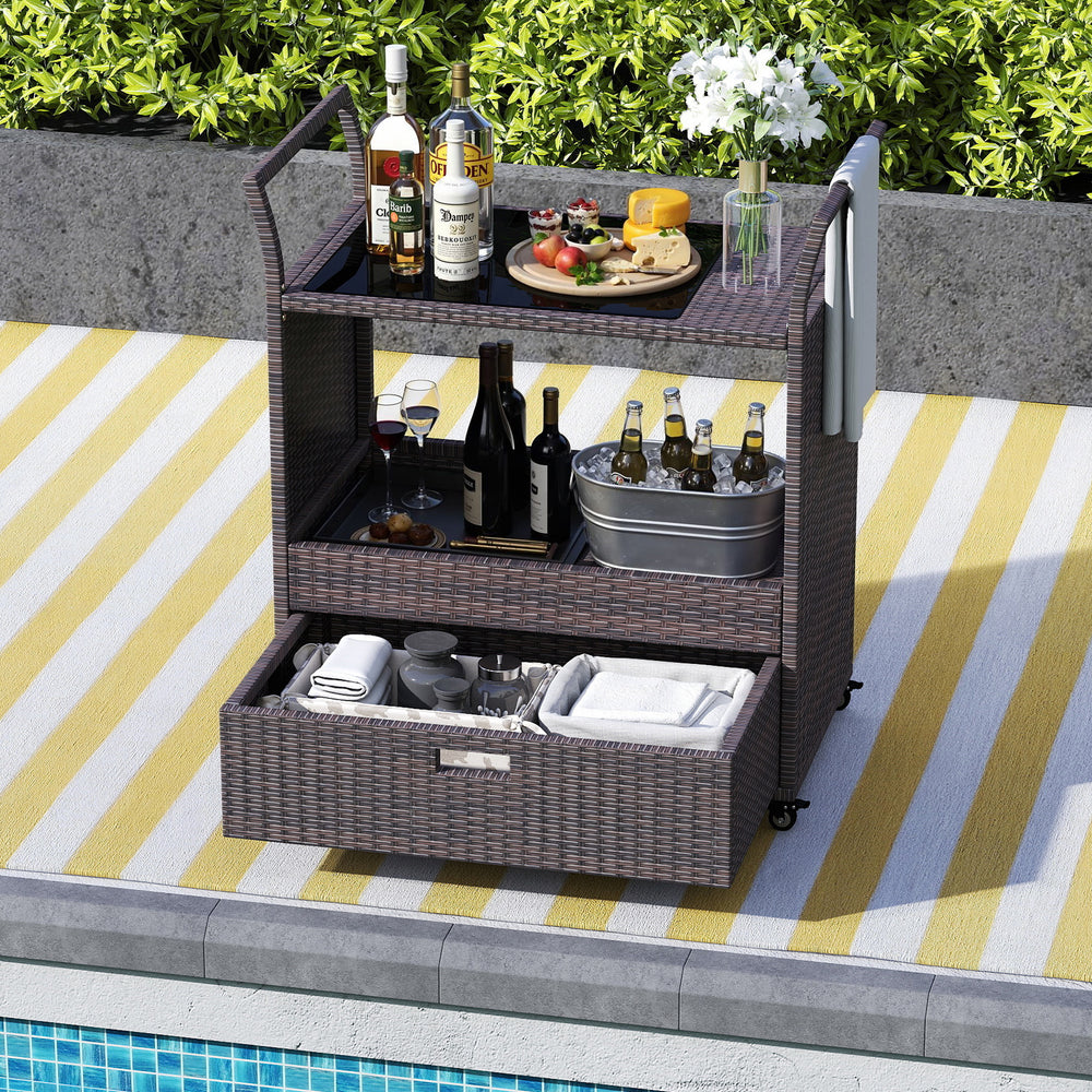 Outdoor wicker bar cart with tempered glass top, featuring ample storage, wheels for mobility, and stylish PE rattan.