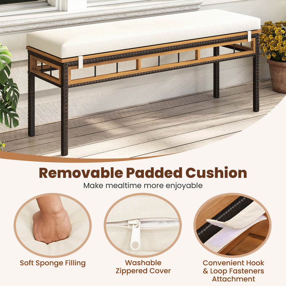 Removable padded cushion with zippered cover on a PE wicker patio dining set for comfortable outdoor seating.