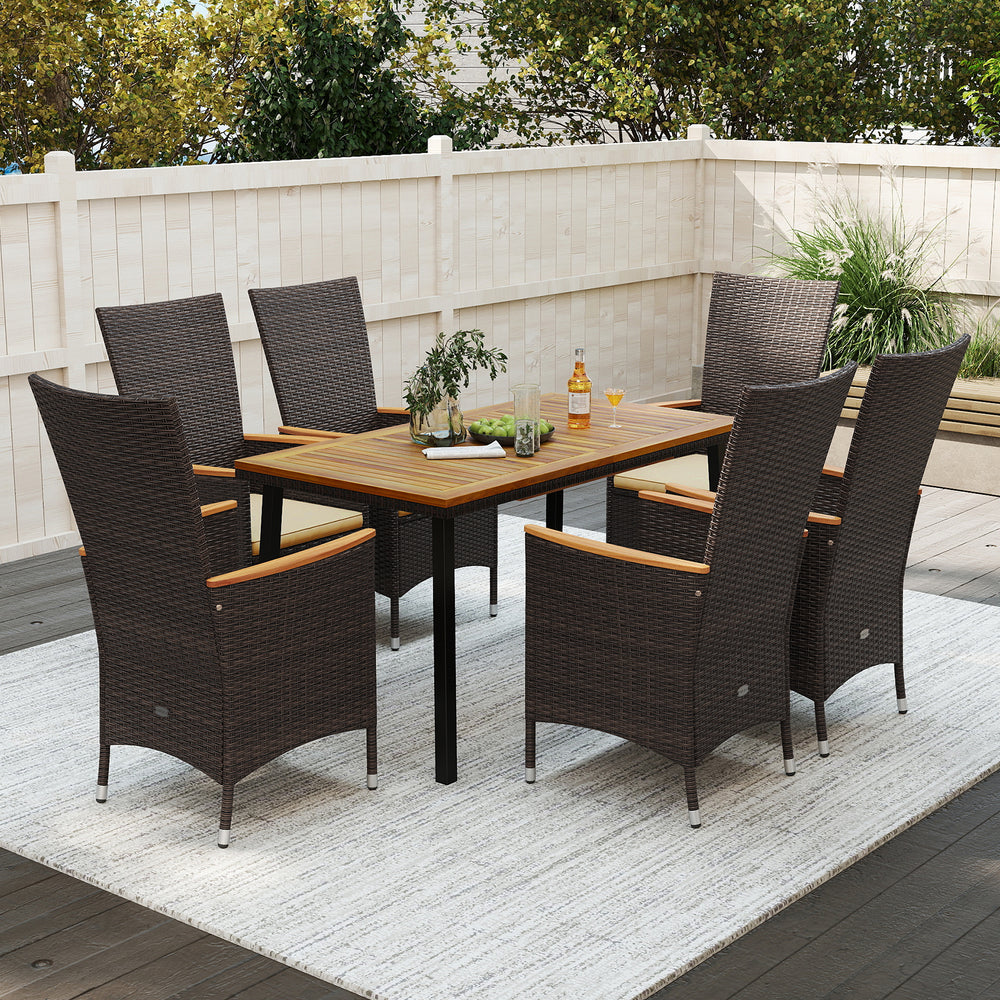 Outdoor dining set for 6 featuring wicker armchairs and a natural acacia wood table, perfect for patio gatherings.