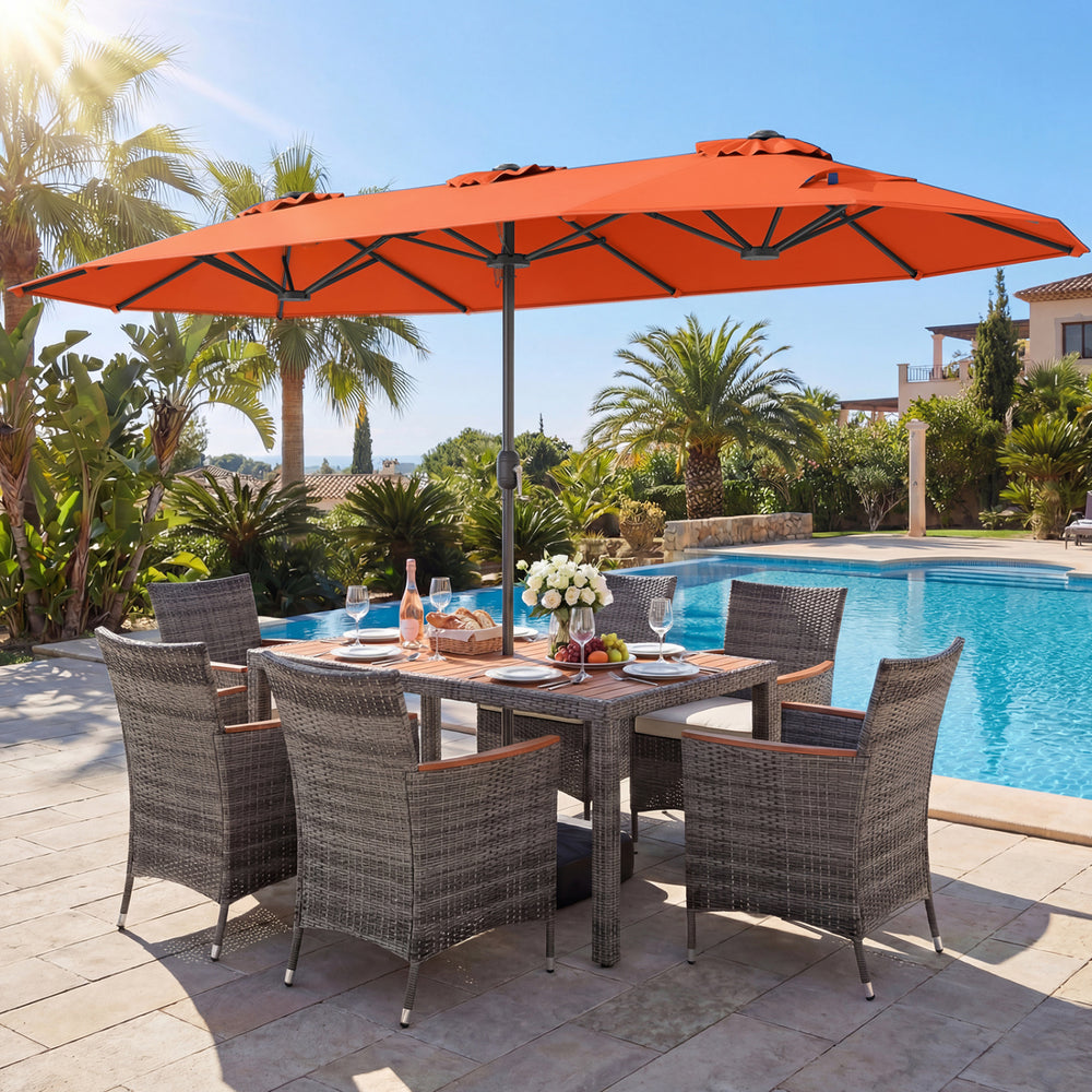 8-piece patio dining set featuring an orange double-sided umbrella and rattan chairs, perfect for outdoor dining.