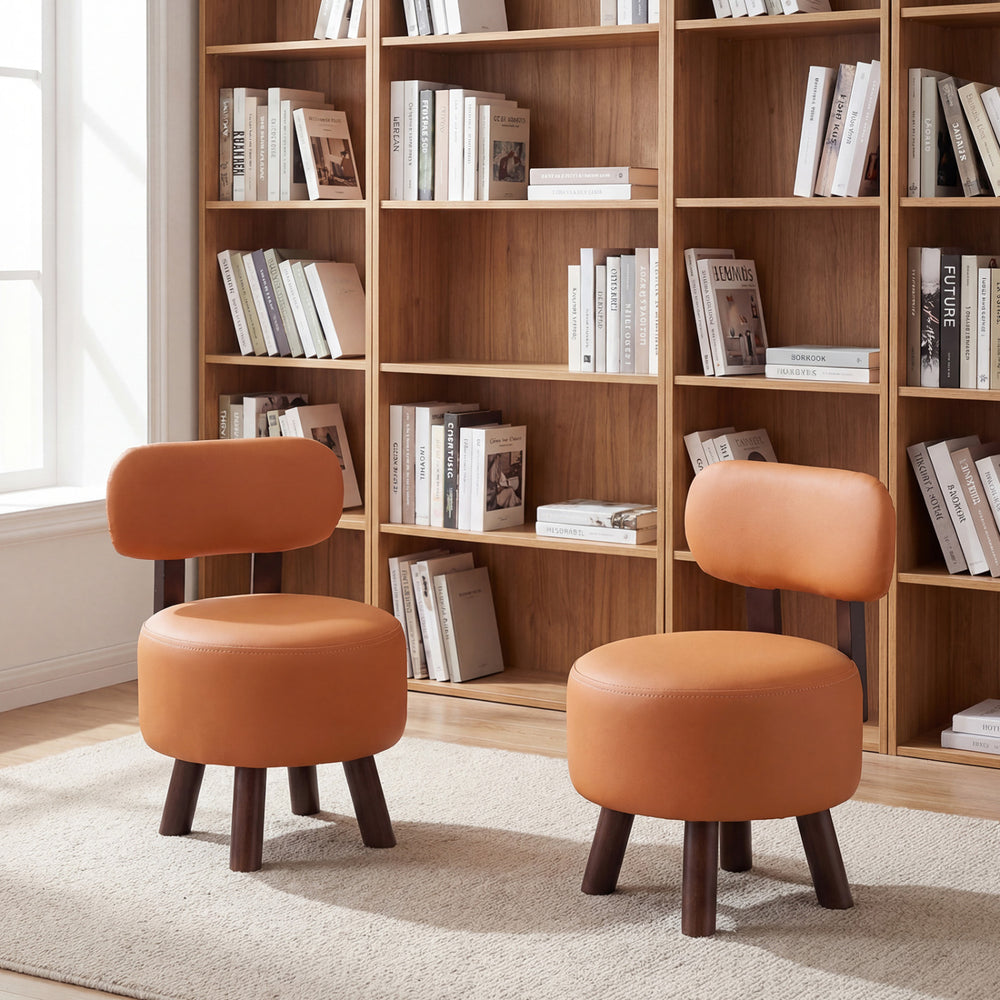 Set of 2 round orange footrest stools with backrest, featuring rubber wood legs and ergonomic design for comfort.