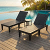 Adjustable recliner chairs and round side table in a 3-piece patio lounge set for poolside relaxation.