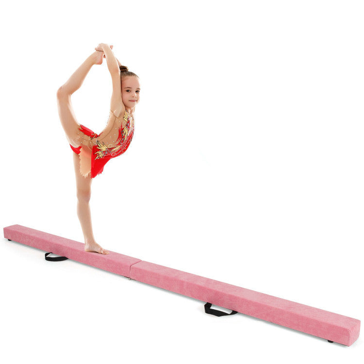 Folding gymnastics mat and portable floor balance beam set with a young gymnast performing a split pose.