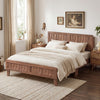 Mid Century queen size bed frame with woven accent headboard in natural finish, styled with cozy bedding in a bright.
