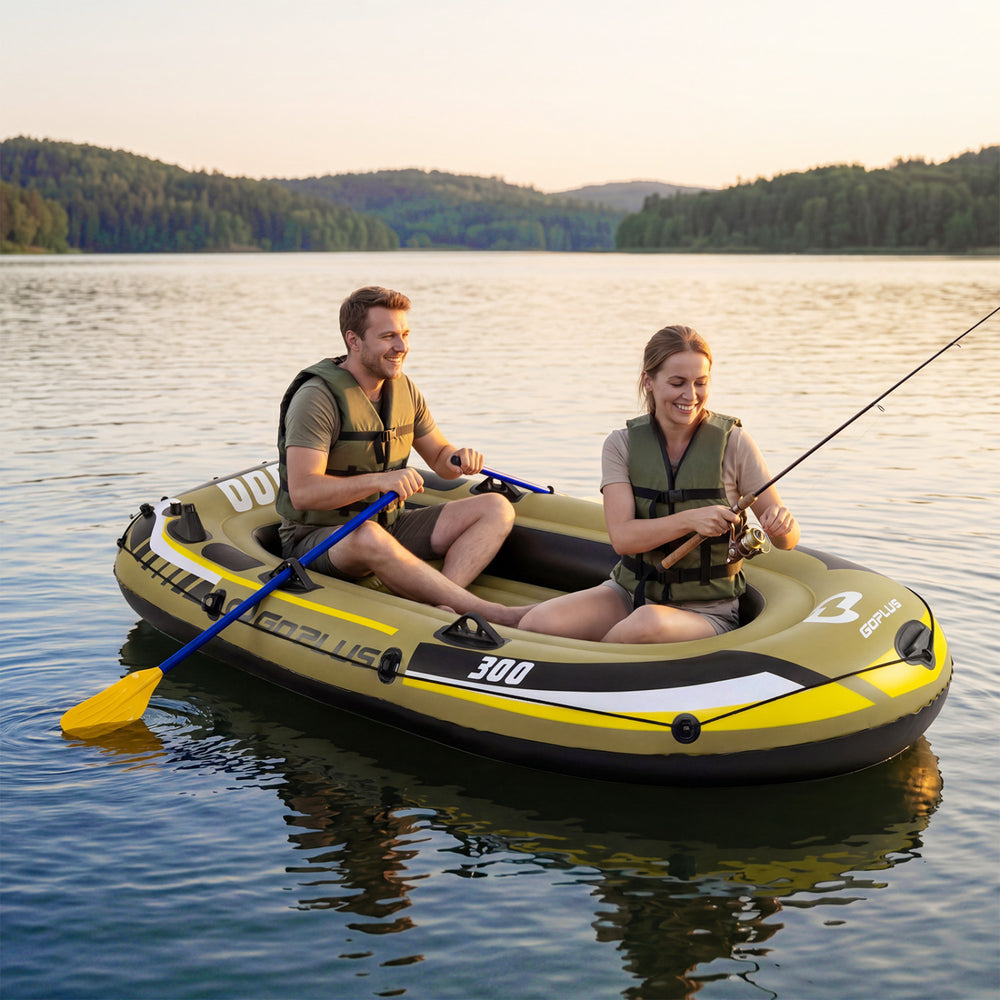Three-person inflatable fishing raft in green, featuring oars and pump, ideal for lake adventures.