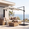 10 FT cantilever patio umbrella in beige with solar LED lights, positioned over a rattan sofa set for outdoor.