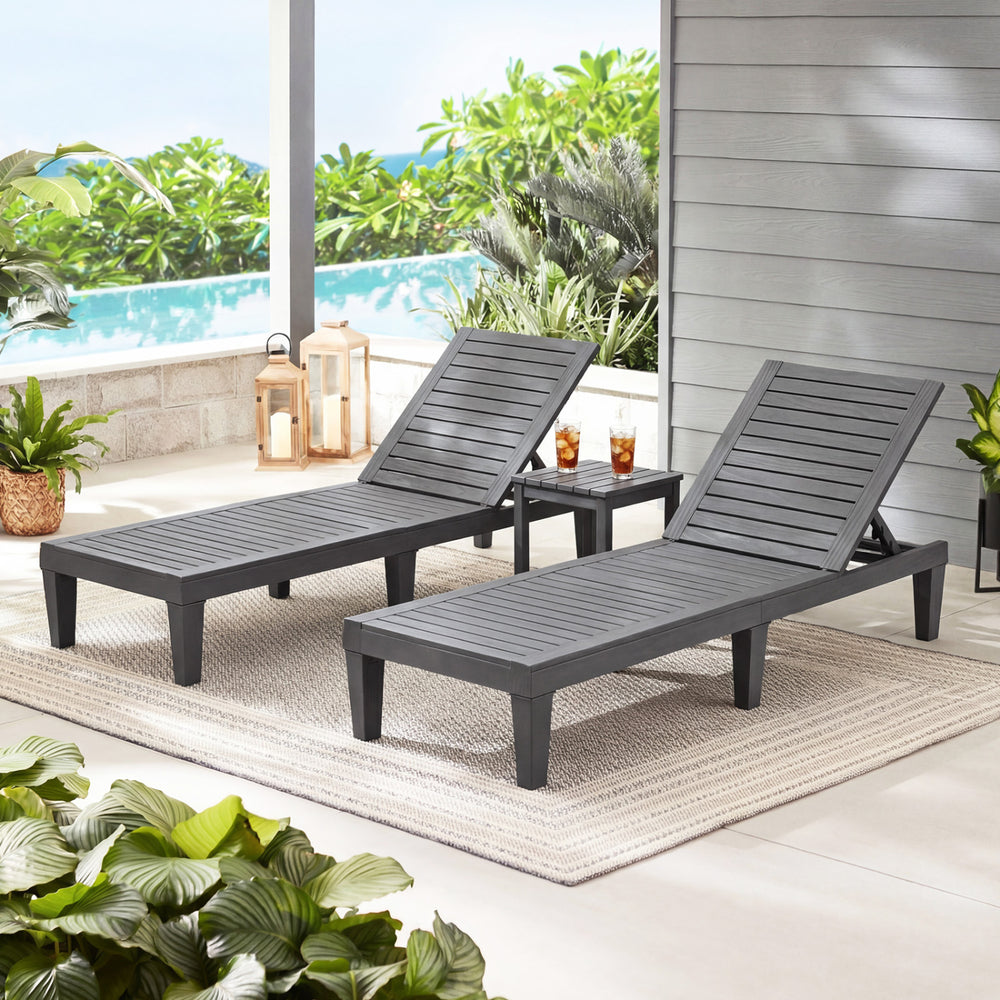 Set of 2 gray outdoor chaise lounge chairs with adjustable backrests, perfect for patio or poolside relaxation.