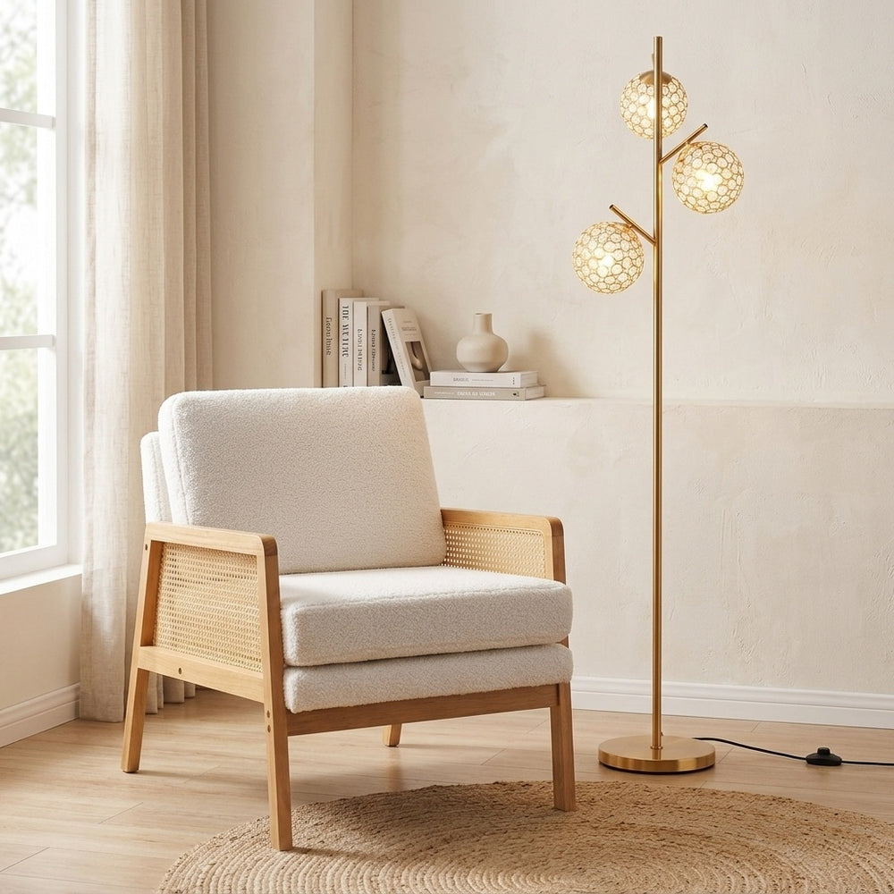 Mid-century modern accent chair with PE rattan armrests and a 3-globe floor lamp, perfect for stylish living spaces.
