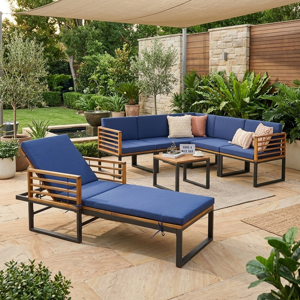 Chaise lounge and conversation sofa set in acacia wood, featuring blue cushions for stylish outdoor relaxation.