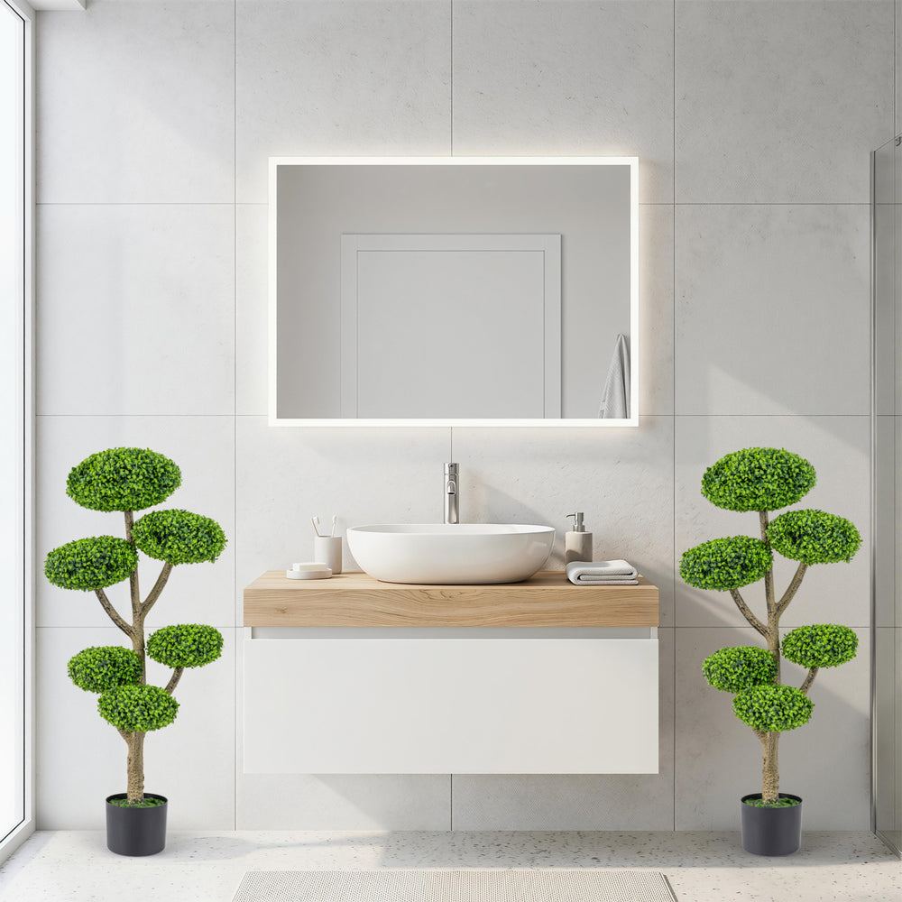Set of 2 indoor outdoor topiary trees with realistic trunks, featuring vivid leaves in weighted cement-filled pots.