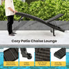 Folding padded rattan chaise lounge with side table features a durable metal frame and adjustable backrest for outdoor comfort.