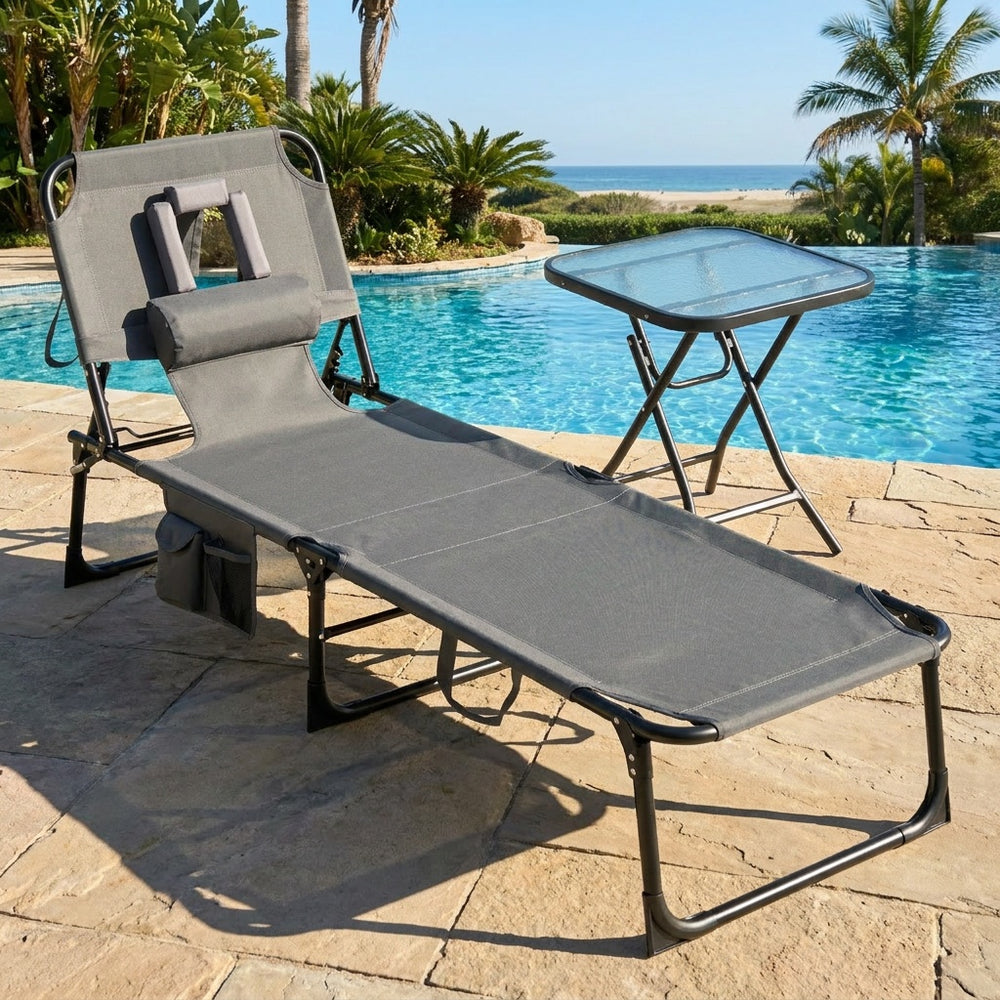 The 2-piece outdoor tanning chair and patio side table set features a foldable lounge chair with adjustable backrest and removable pillow.