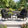 Black outdoor wicker rocking chairs with thick cushions, featuring anti-tip stoppers, perfect for porch relaxation.