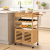 Bamboo rolling kitchen island trolley with wine rack, storage cabinet, and towel rack for versatile kitchen organization.