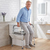 Heavy-duty raised toilet seat with non-slip handles supports up to 400 lbs, ideal for elderly or disabled users.