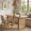 Boho-style 55” solid rubber wood dining table set with woven resin wicker details, seating 4 for everyday meals.