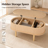Oval lift top coffee table with fluted design features three storage compartments for books, laptops, and snacks.