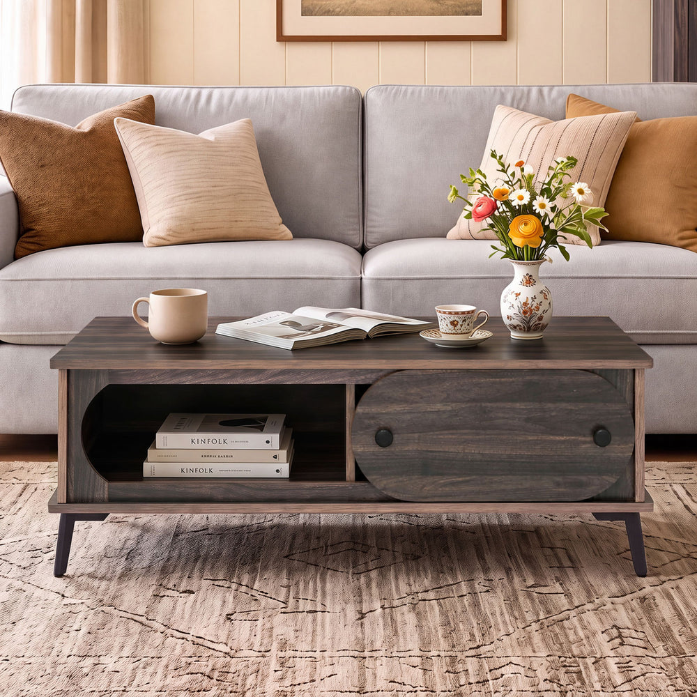 Modern wooden center table in walnut with spacious tabletop and sliding door, perfect for stylish living room organization.