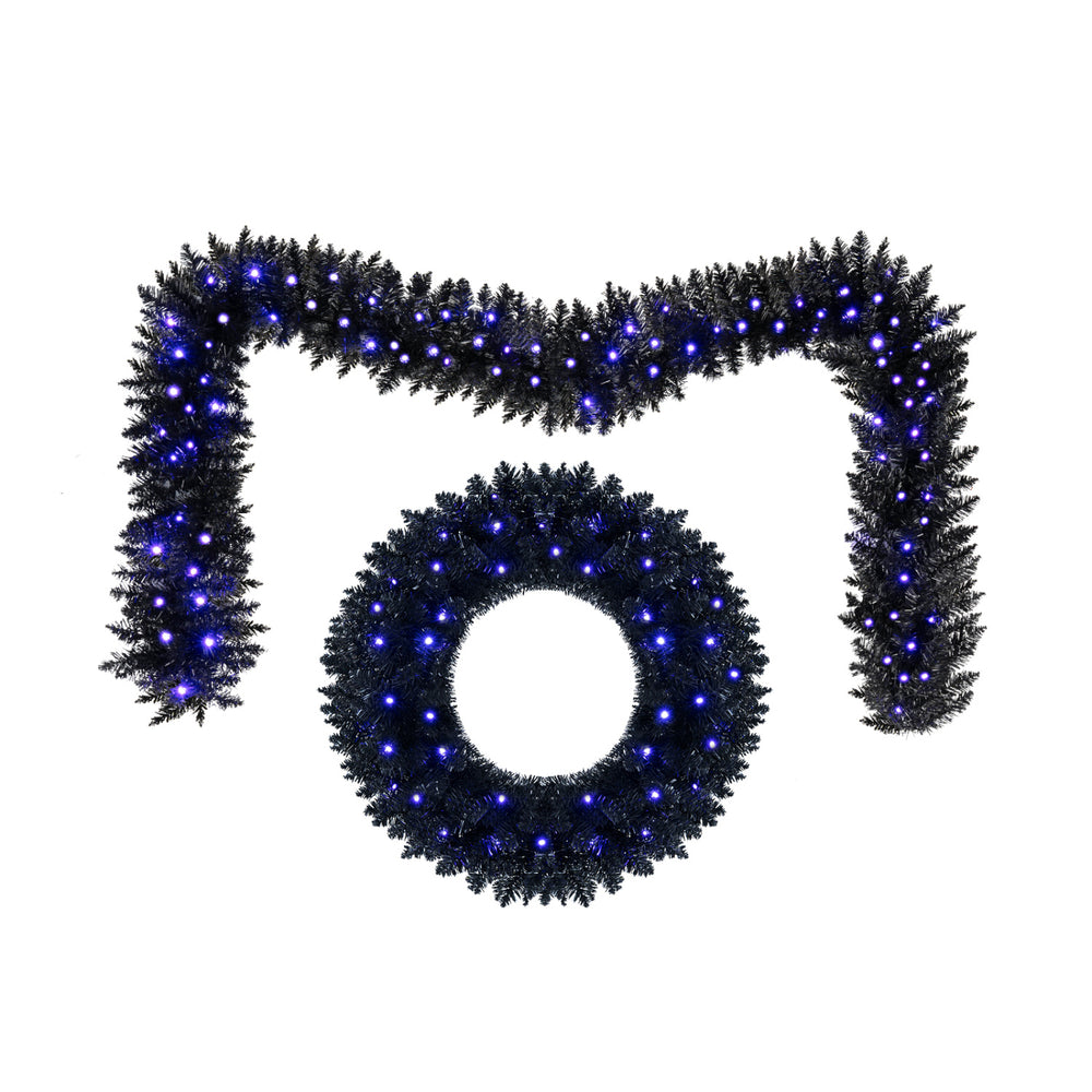 Black 24-inch wreath and 9-foot garland set with 389 branch tips and purple LED lights for Halloween decorations.