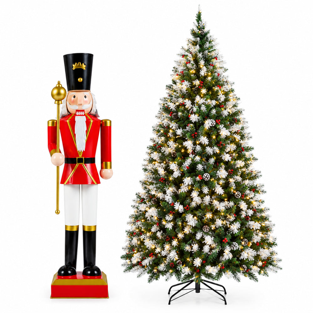 Snow flocked 7.5ft Christmas tree with 550 warm white LED lights and a 32.5-inch nutcracker for festive holiday displays.