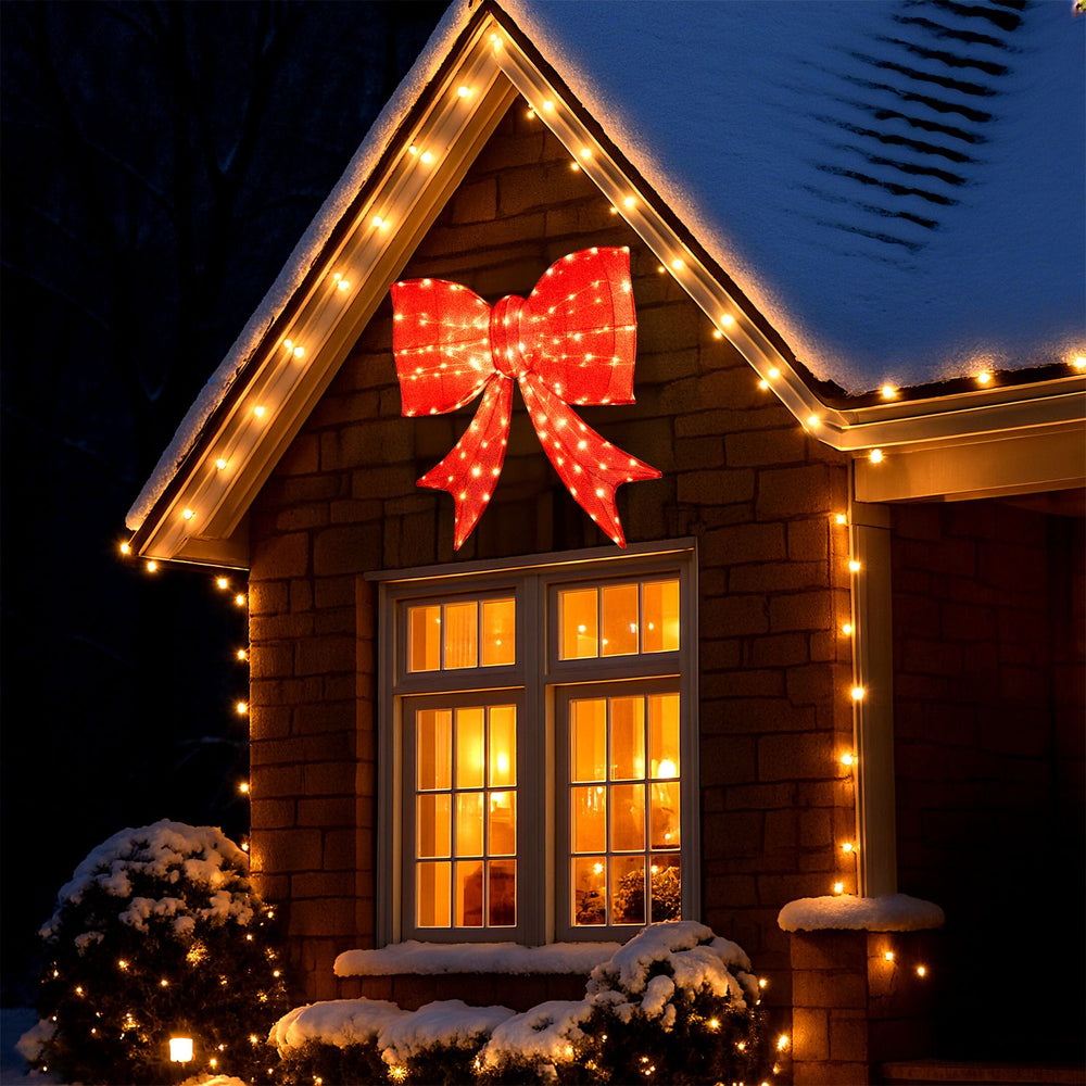 Extra-large 37-inch lighted Christmas bow decoration with 150 warm white LED lights for festive outdoor holiday displays.