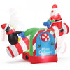 Inflatable 5.1 FT Christmas seesaw featuring Santa and penguin with LED lights, perfect for festive garden displays.
