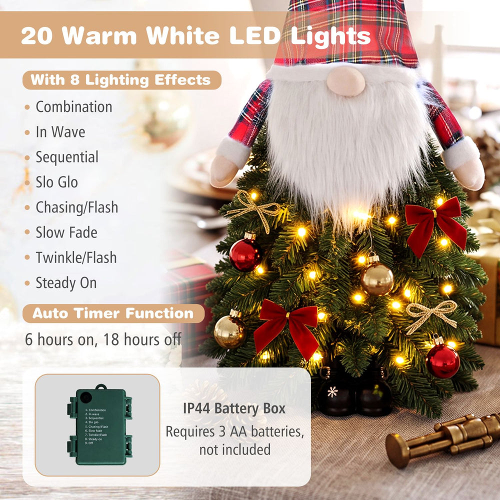 3 ft pre-lit mini tabletop Christmas tree with 20 warm white LED lights and Santa-inspired design for festive decor.