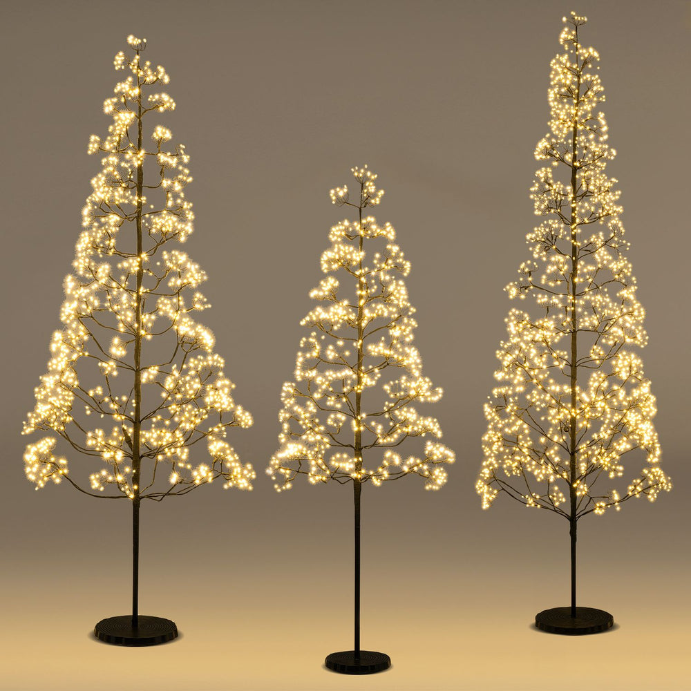 Lighted alpine trees in 5, 6, and 7 FT heights with warm white LEDs, perfect for Christmas or seasonal decor.