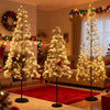 Lighted alpine trees in 5, 6, and 7 feet heights with warm white LEDs, perfect for festive decorations and events.