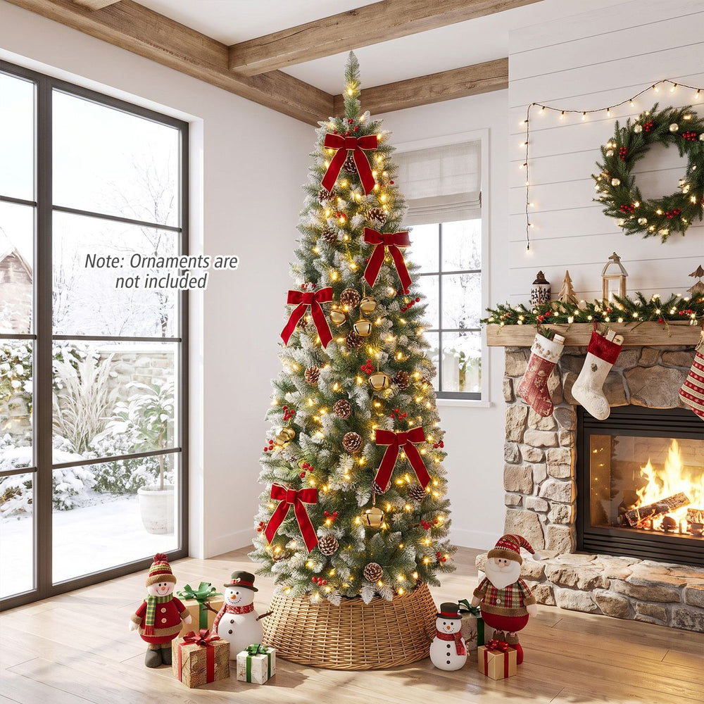 6FT Frosted Pencil Fir Christmas Tree with warm white LED lights, pine cones, and red berry clusters in a living room