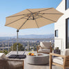 Beige 11 ft cantilever patio umbrella with heavy-duty 4-piece base, shown open over a balcony seating area.