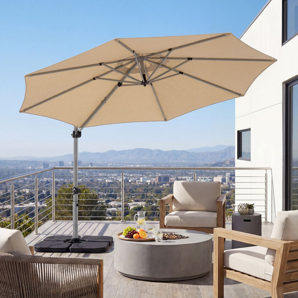 Beige 11 ft cantilever patio umbrella with heavy-duty 4-piece base, shown open over a balcony seating area.