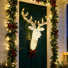 3D Rudolph hanging wreath with glowing LED antlers and red bow decorates a Christmas door.