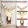 Pre-lit 3D Rudolph hanging wreath with glowing antlers, warm white LED lights, and a red bow, shown on a wall.