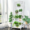 4-tier white leaning ladder shelf showcasing plants and decor, made of durable MDF, perfect for home or office storage.