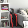 Adjustable red abdominal twister trainer with foam rollers, positioned beside a bookshelf in a modern living room.