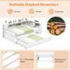 Twin size daybed frame in white with trundle, plywood slats, and reversible bookshelf for versatile storage solutions.